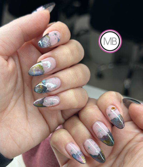 Celestial galaxy nail art with holographic glitter and hand-painted star details on almond nails by ManiBliss nail salon
