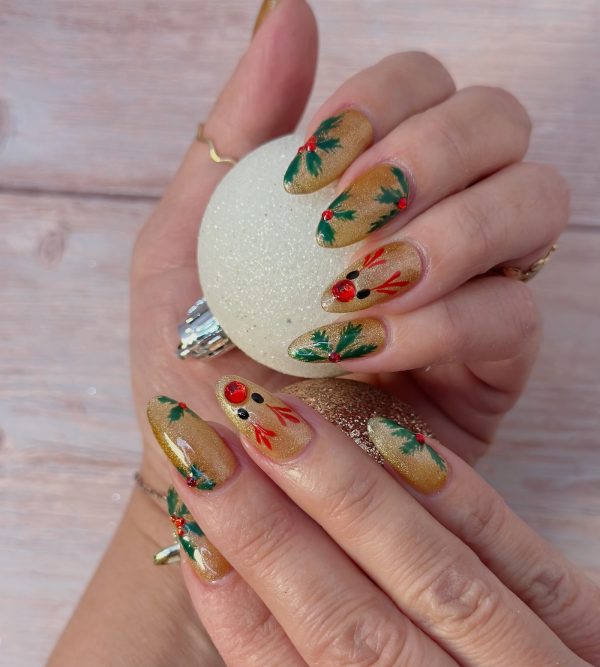 Christmas holiday nail art with gold shimmer base holly leaves red berries and Rudolph reindeer by ManiBliss nail salon