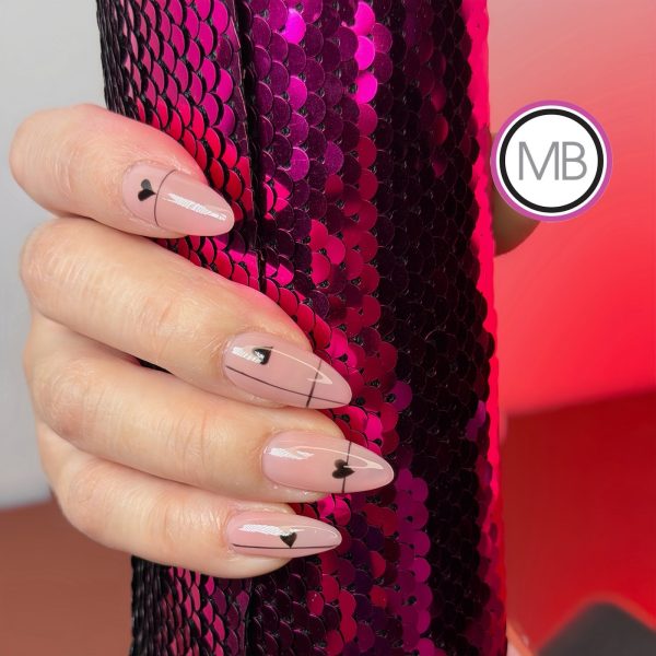 Minimalist nude almond nails with black line art and tiny heart accents by ManiBliss nail salon Alpharetta GA